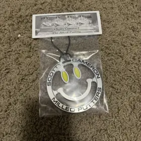 193883433 Scotty Cameron 2024 Mardi Gras Smiley Face Bag Tag