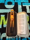 2024 Scotty Cameron Roller Clip Pivot Tool Orange New Tin. Price: $170.00.