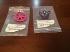 Scotty Cameron Purple Soft Touch Mini Crown And Pink Peace Sign Key Fobs New. Price: $65.00.