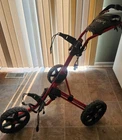 Clicgear Golf Used 3-WHEEL Red Push Cart. Price: $120.00.