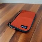 Kavu Jet City Crossbody Bag Zipper Pouch Travel Organizer Orange Teal Cord Strap Pre-owned. Price: $24.99.