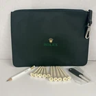 Rolex Golf Set Pouch Includes Pencil, Divot Tool, 10 Tees Used. Price: $105.60.