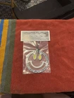 *new* Scotty Cameron 2024 Mardi Gras Smiley Face Bag Tag. Price: $143.19.
