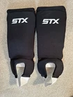 Stx Field Hockey Shin Guards Reversible Size Adult Black/white Hinged Foam Pre-owned. Price: $21.99.